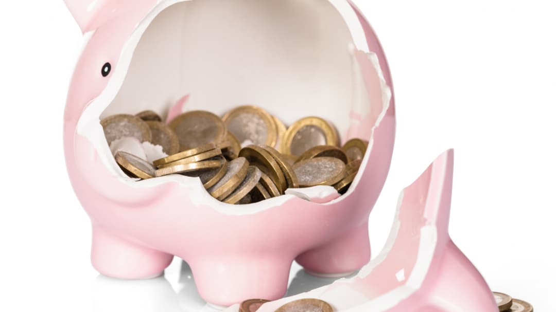 11683243-broken-piggy-bank-with-money.jpg
