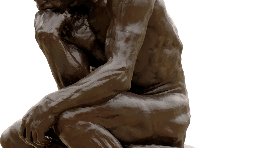 sculpture of man sitting down