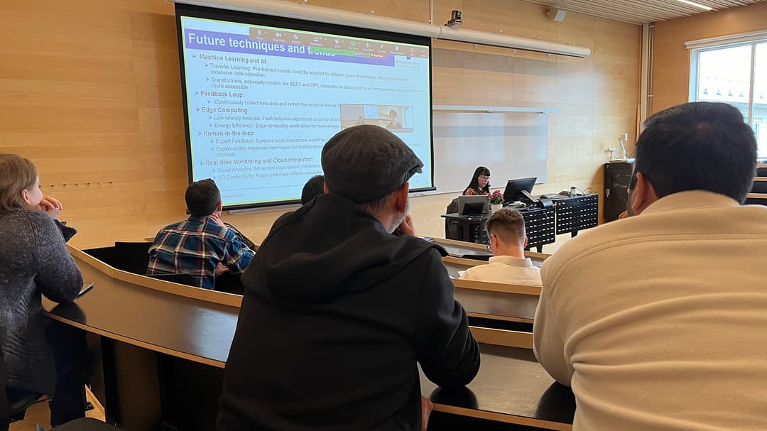 The audience sits and listens to a dissertation.