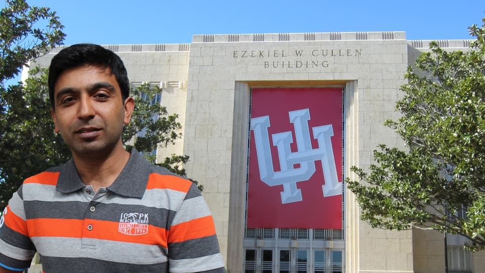 A man edited in front of University of Houston