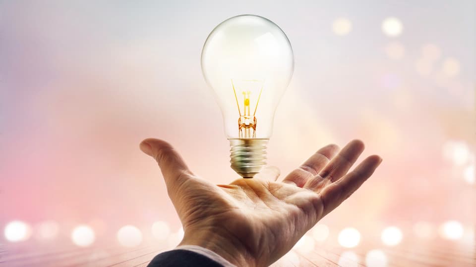 Innovation hand light bulb.jpg