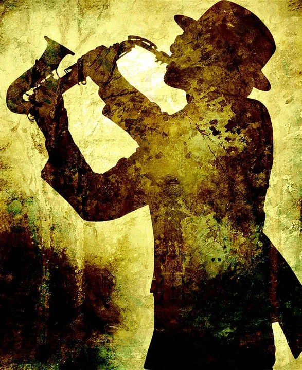 a silhuette of a person who plays saxophone