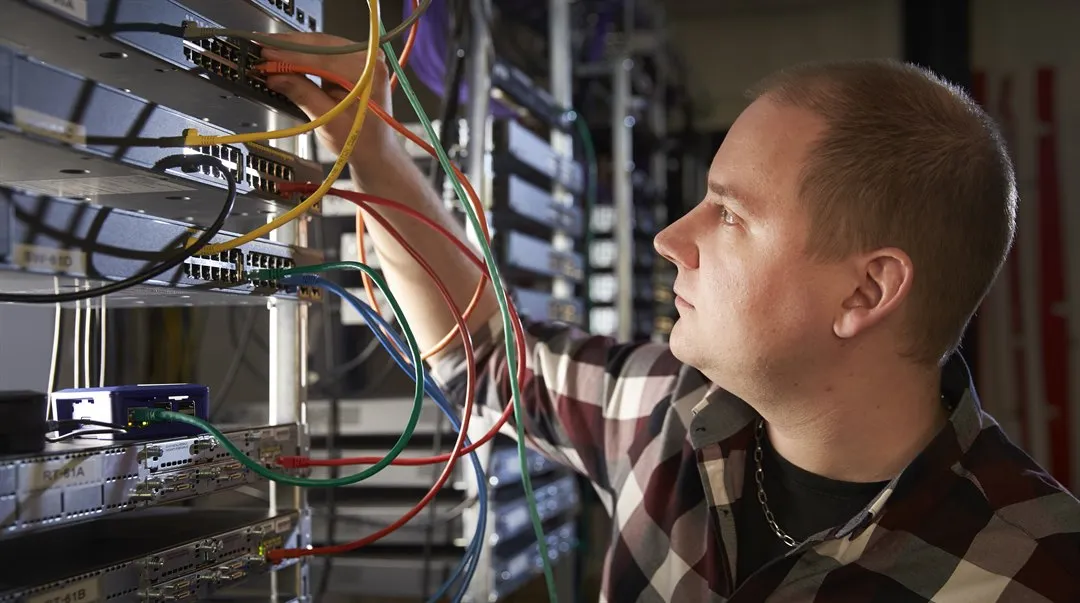 A man in a server room.
