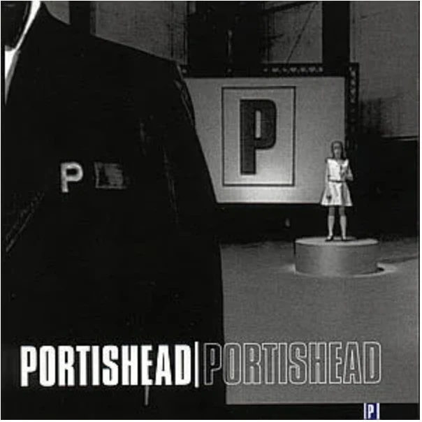 album cover, a woman stands far away in front of the letter P