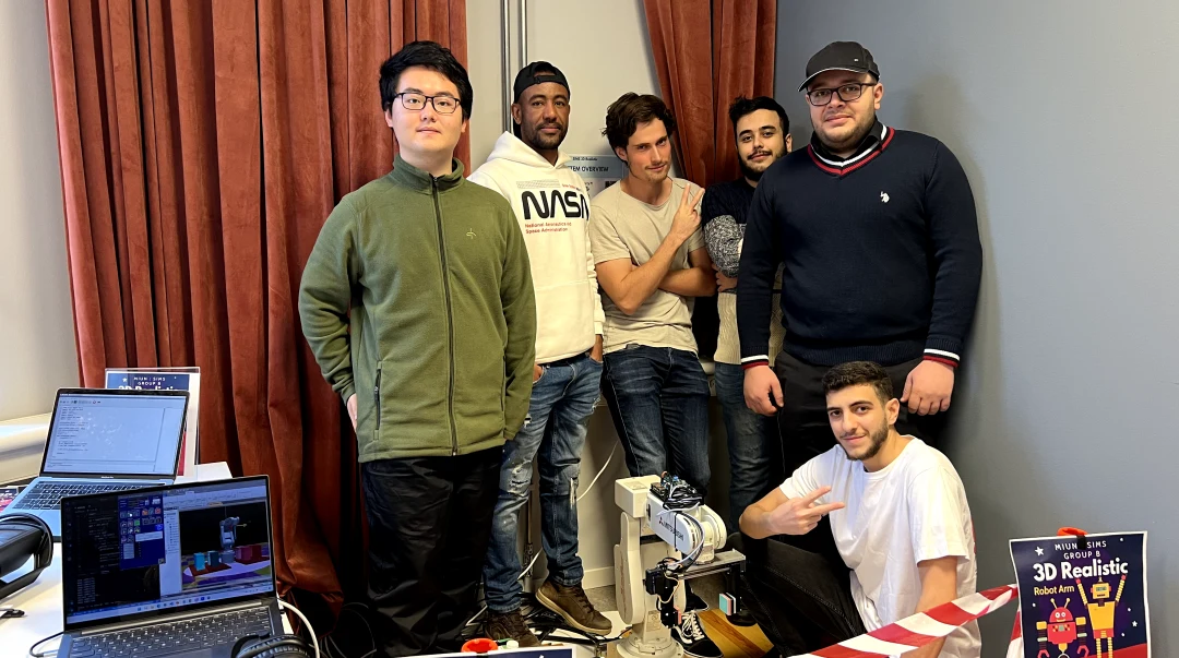 sex personer bakom en robotarm